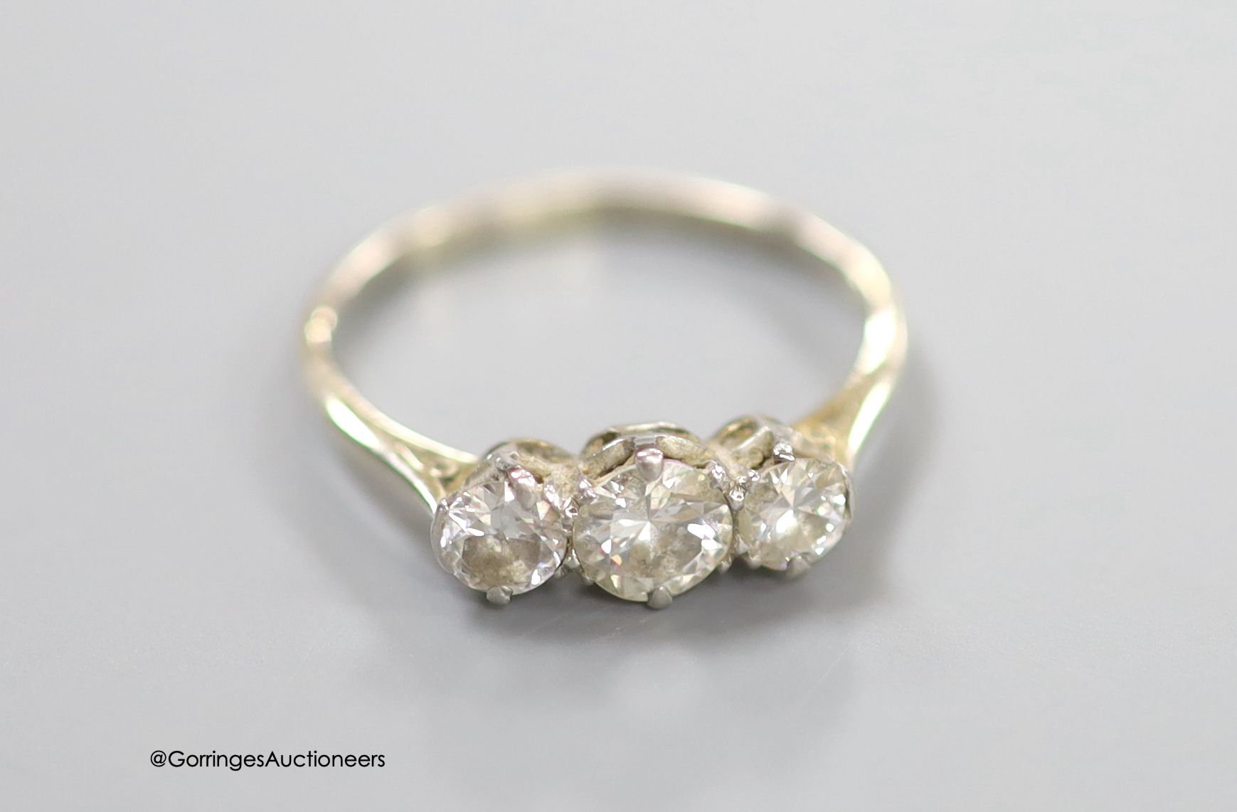 An 18ct and three stone diamond set ring, size P, gross weight 2.3 grams